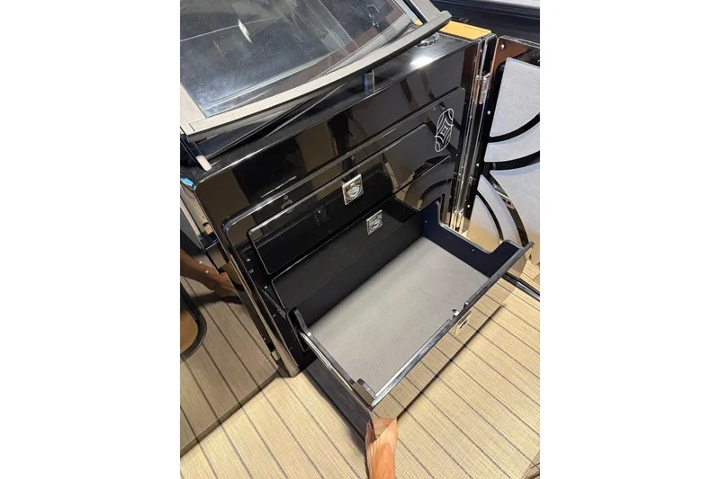 Slide: The Image of Open storage compartment in 2026 Balise Halo 26C Twin, showcasing sleek design and functionality. - 12