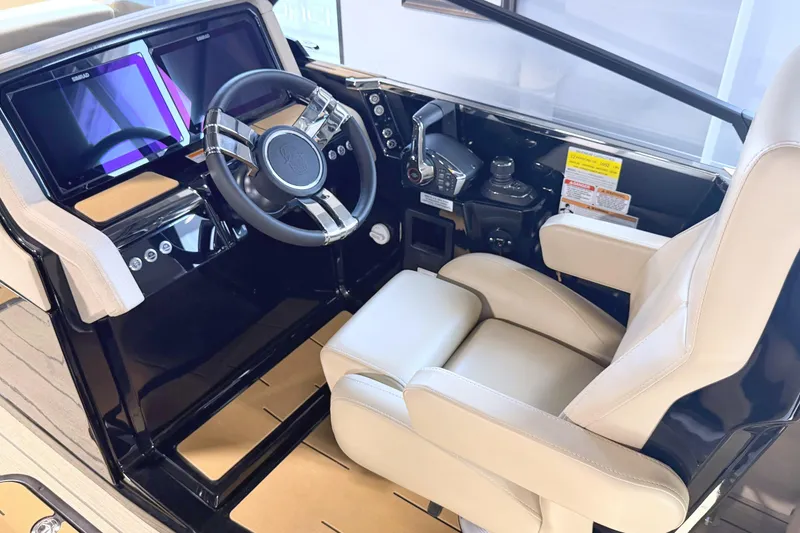 Slide: The Image of The image shows the cockpit of a 2026 Balise Halo 26C Twin with a modern steering wheel and large screen. - 9