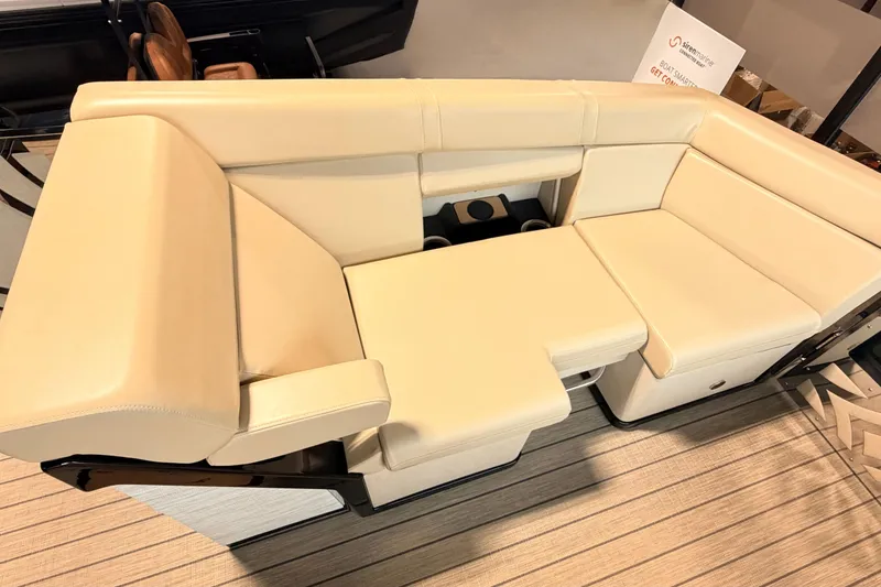 Slide: The Image of Luxurious beige seating on the 2026 Balise Halo 26C Twin boat, featuring integrated cup holders. - 21