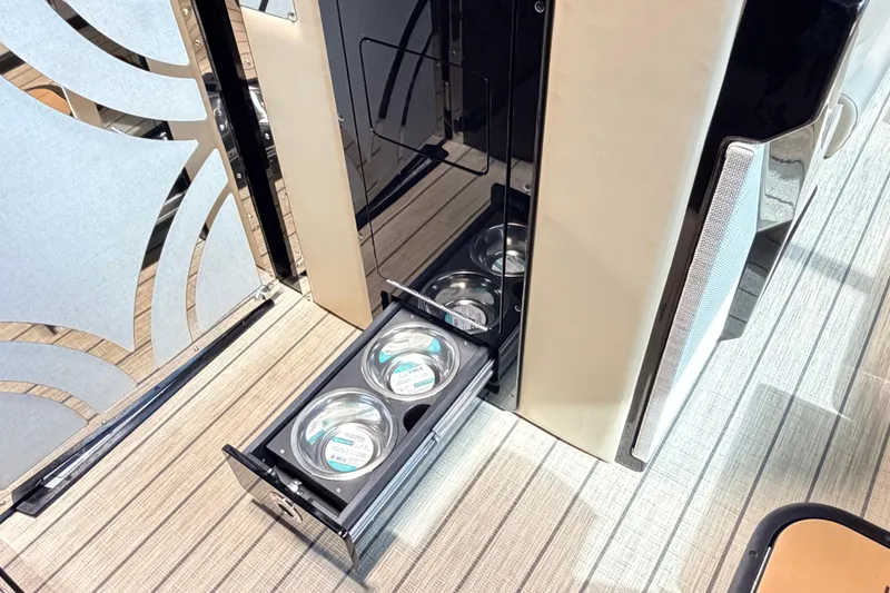 Slide: The Image of Pull-out drawer with pet bowls in Balise Halo 26C Twin, 2026 model, on a stylish interior floor. - 15