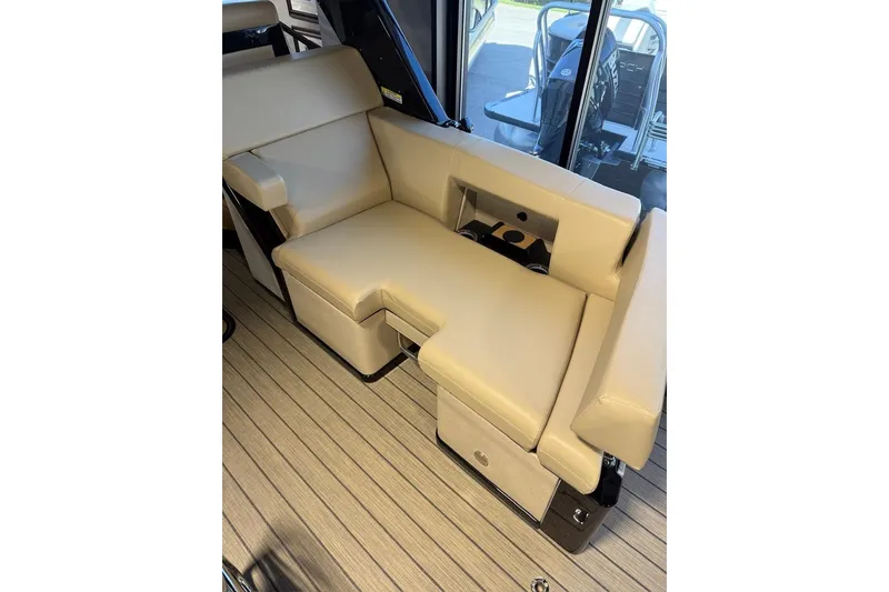 Slide: The Image of Luxurious seating on the 2026 Balise Halo 26C Twin boat, featuring beige upholstery. - 5