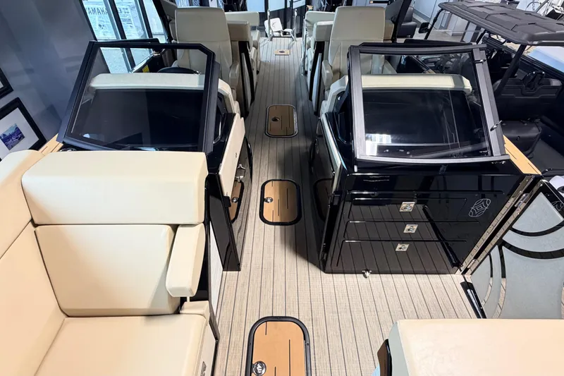 Slide: The Image of Luxurious interior of 2026 Balise Halo 26C Twin boat with beige seating and sleek design. - 17