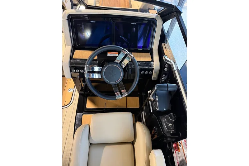 Slide: The Image of Interior cockpit of 2026 Balise Halo 26C Twin boat with modern steering and controls. - 24