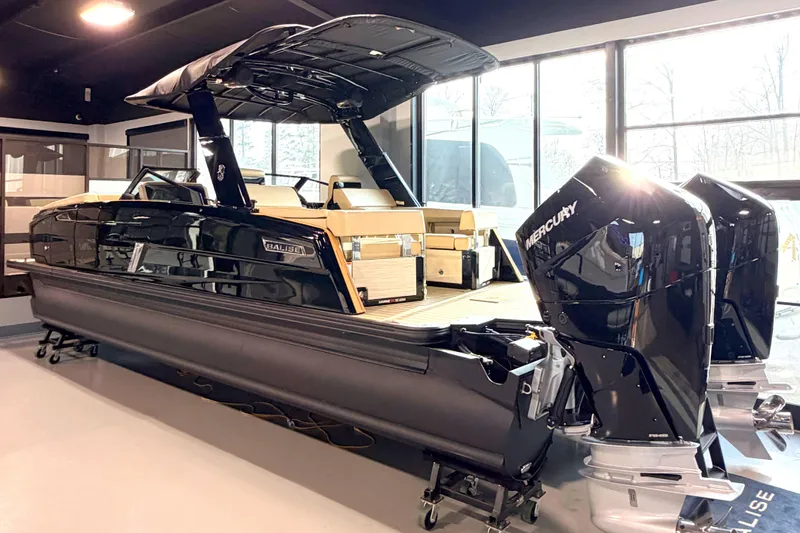 Slide: The Image of 2026 Balise Halo 26C Twin boat with dual Mercury engines in showroom. - 1