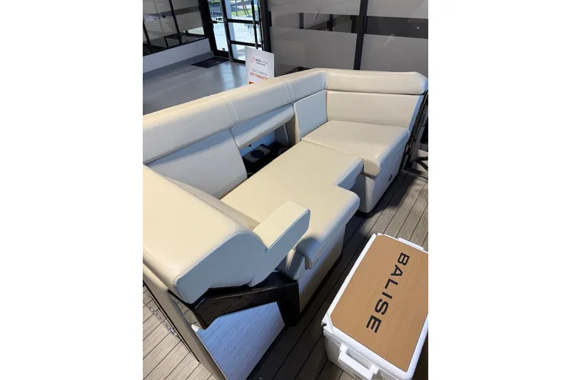 Slide: The Image of Luxurious seating on the 2026 Balise Halo 26C Twin boat, featuring cream upholstery. - 16