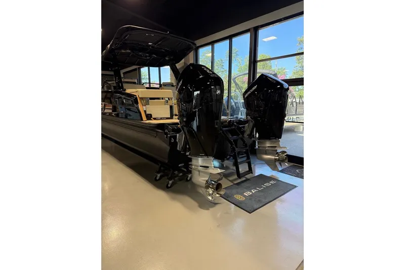 The Image of 2026 Balise Halo 26C Twin boat with dual outboard motors in showroom. - 1