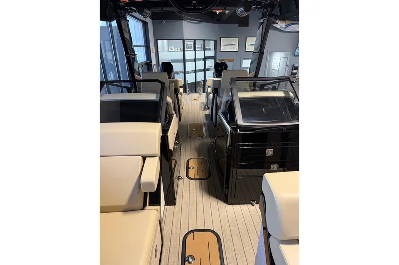 Slide: The Image of Interior view of 2026 Balise Halo 26C Twin boat with modern seating and controls. - 10
