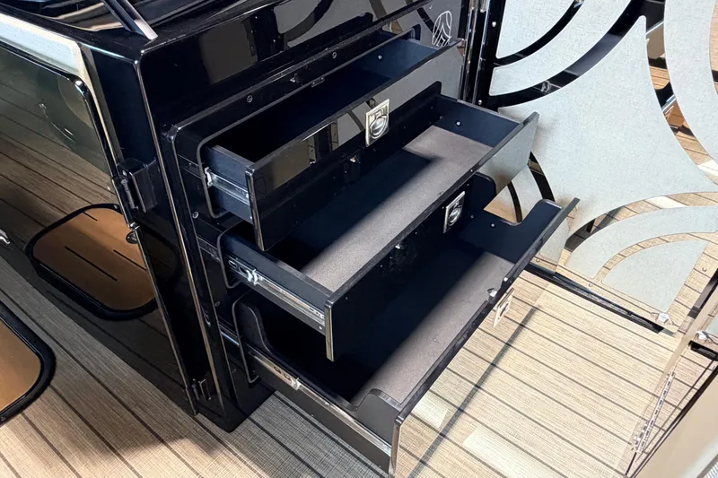 Slide: The Image of Open storage drawers in a 2026 Balise Halo 26C Twin, showcasing sleek design and functionality. - 14