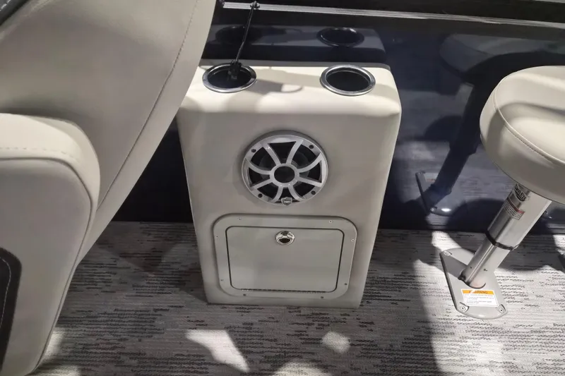 Slide: The Image of 2026 Sylvan R-22 LZ DH boat interior with speaker and cup holders. - 13