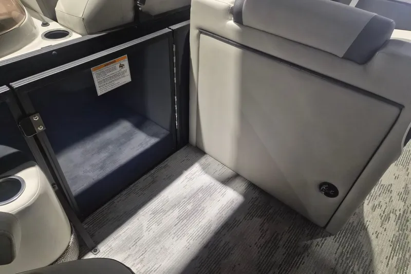 Slide: The Image of Interior of 2026 Sylvan R-22 LZ DH boat, featuring seating and storage area. - 8
