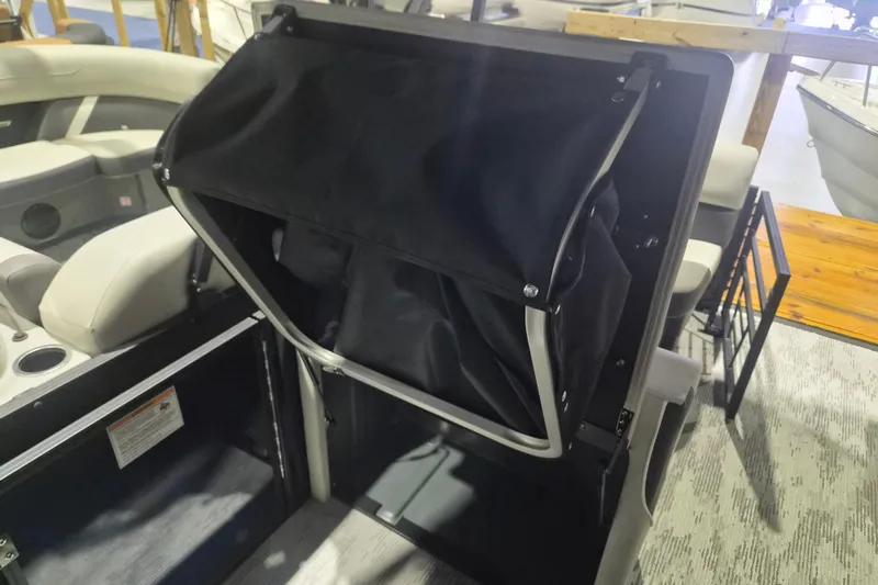Slide: The Image of 2026 Sylvan R-22 LZ DH boat interior with seating and storage compartment. - 9