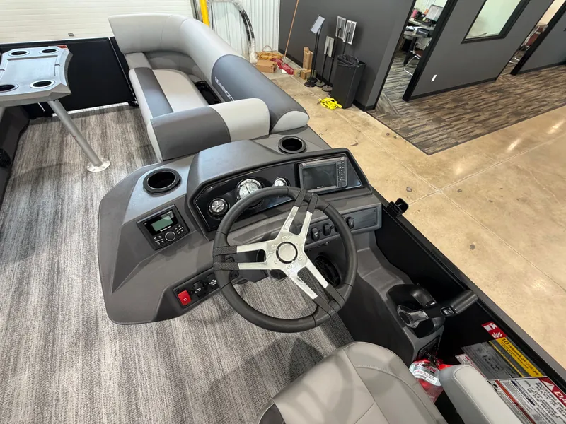 Slide: The Image of Interior view of a modern boat with a gray steering wheel and dashboard. - 7