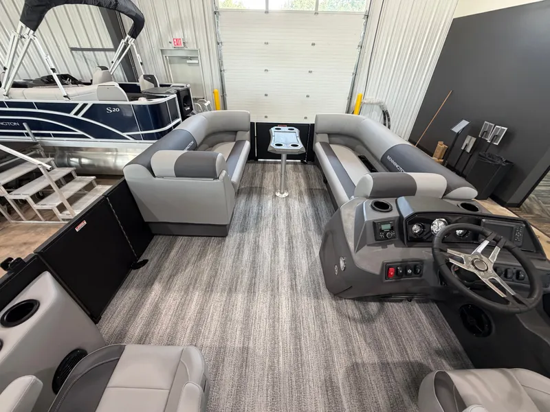 Slide: The Image of Interior of a modern pontoon boat with gray seating and a helm station. - 8