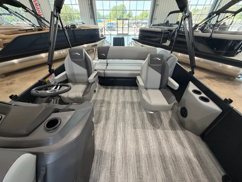 Slide: The Image of Interior of a modern pontoon boat with gray seating and carpeted floor. - 9