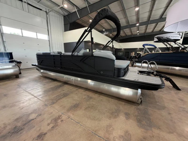 Slide: The Image of Bennington S Series 22 SSB pontoon boat indoors with a raised sunshade. - 4