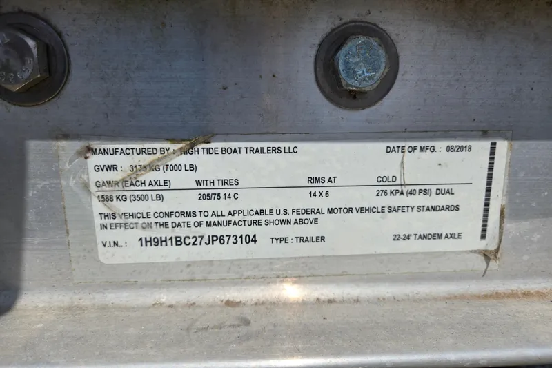 Slide: The Image of Label on a High Tide Boat Trailer, manufactured August 2018, showing specifications and VIN. - 38