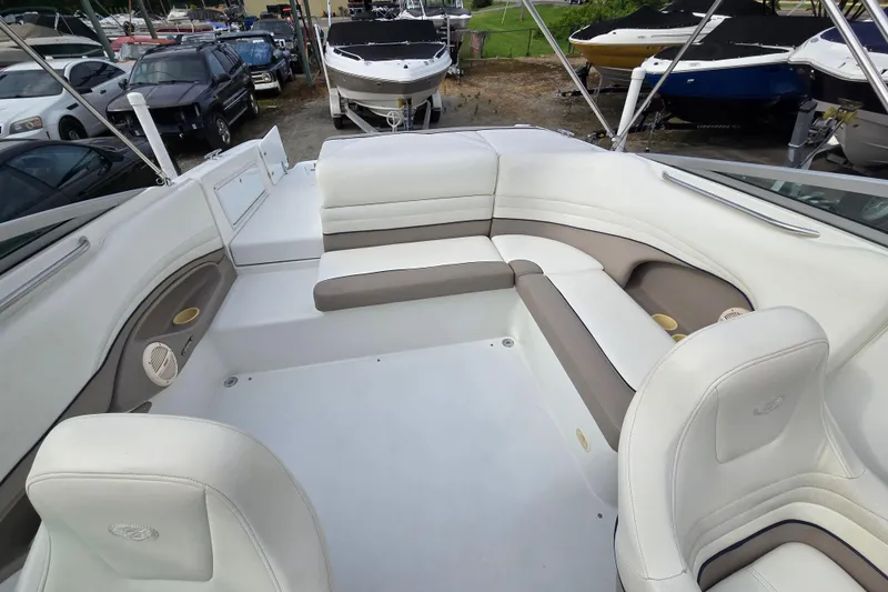 Slide: The Image of Interior of a 2000 Cobalt 246 boat with white and beige seating. - 13