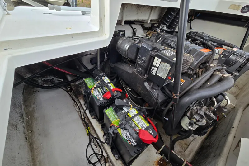 Slide: The Image of Engine compartment of a 2000 Cobalt 246 boat with visible batteries and wiring. - 30