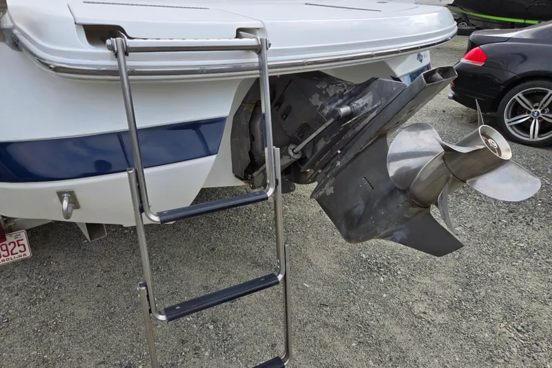 Slide: The Image of Rear view of a 2000 Cobalt 246 boat with ladder and propeller. - 8