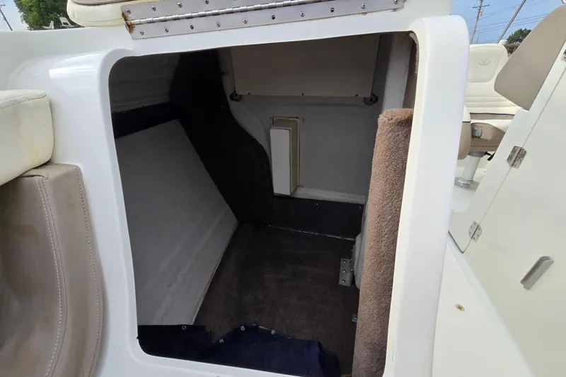 Slide: The Image of Interior cabin of a 2000 Cobalt 246 boat, featuring seating and storage space. - 25
