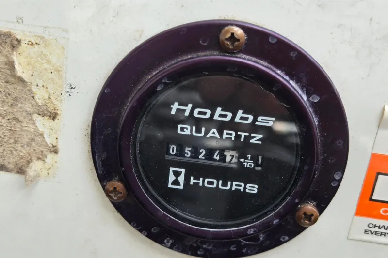 Slide: The Image of Hobbs Quartz hour meter showing 5247.1 hours on a 2000 Cobalt 246. - 35