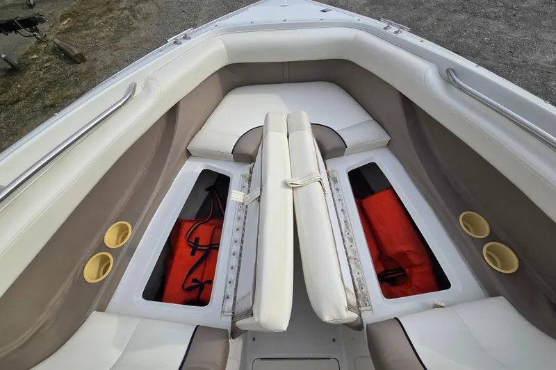 Slide: The Image of Interior of a 2000 Cobalt 246 boat with storage compartments and seating. - 24