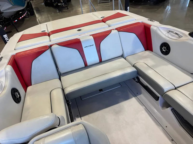 Slide: The Image of Interior of a 2011 Nautique Super Air Nautique 210 with white and red seating. - 15