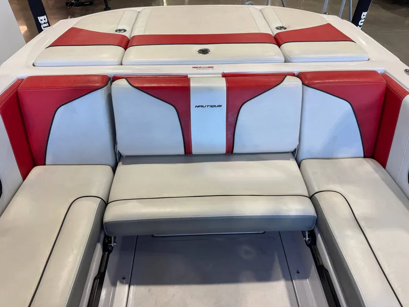 Slide: The Image of Rear seating of a 2011 Nautique Super Air Nautique 210 with white and red upholstery. - 26