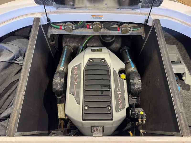 Slide: The Image of Engine compartment of a 2011 Nautique Super Air Nautique 210 with an EX343 engine. - 27