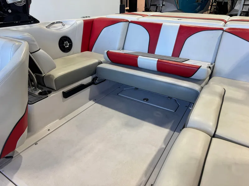 Slide: The Image of Interior of a 2011 Nautique Super Air Nautique 210 with red and white upholstery. - 14