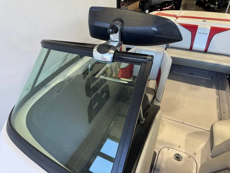 Slide: The Image of Interior view of a 2011 Nautique Super Air Nautique 210 with windshield and rearview mirror. - 19