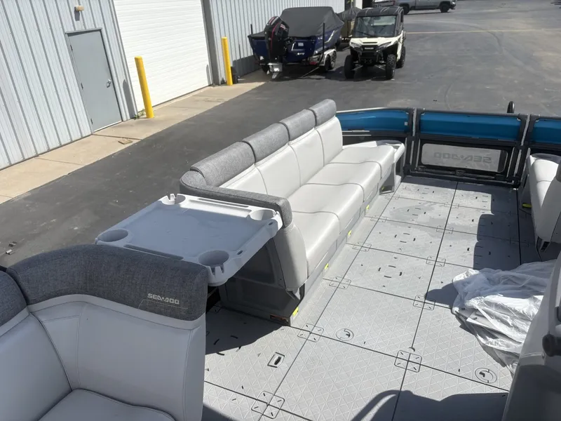 Slide: The Image of The image shows the deck of a 2023 Sea-Doo Switch Cruise 21 with gray seating. - 18