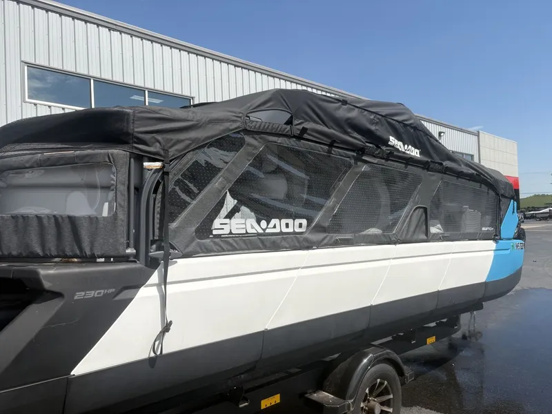 Slide: The Image of A 2023 Sea-Doo Switch Cruise 21 on a trailer in front of a building. - 5