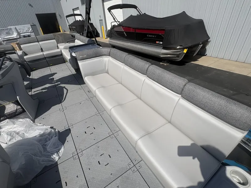 Slide: The Image of The image shows the interior of a 2023 Sea-Doo Switch Cruise 21 with gray and white seating. - 15