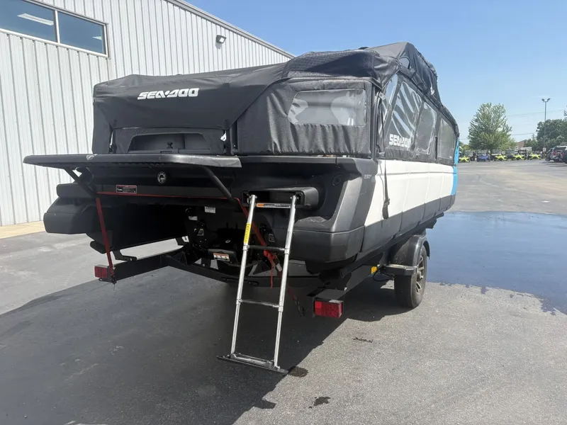 Slide: The Image of A 2023 Sea-Doo Switch Cruise 21 on a trailer in front of a building. - 4