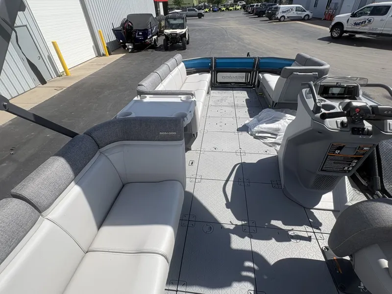 Slide: The Image of The image shows the interior of a 2023 Sea-Doo Switch Cruise 21 with gray seating. - 13