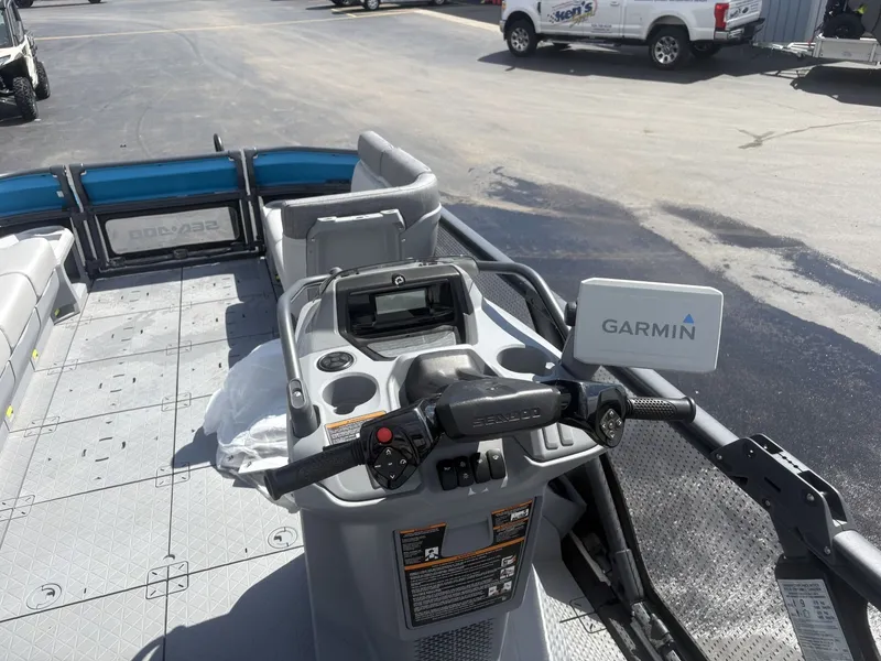 Slide: The Image of The image shows the cockpit of a 2023 Sea-Doo Switch Cruise 21 with Garmin navigation. - 9