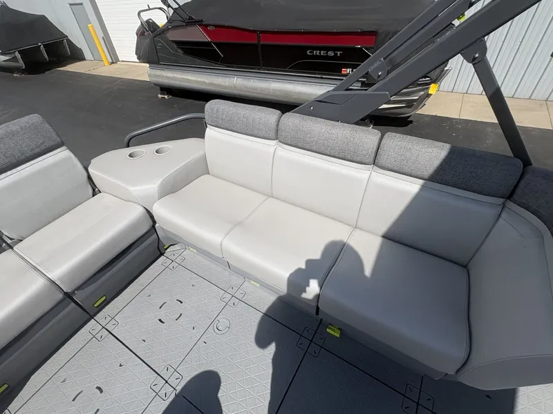 Slide: The Image of The image shows the seating area of a 2023 Sea-Doo Switch Cruise 21. - 16