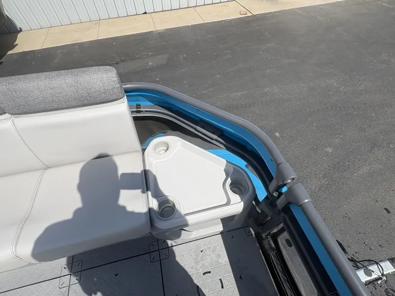 Slide: The Image of The image shows part of the seating area of a 2023 Sea-Doo Switch Cruise 21. - 17