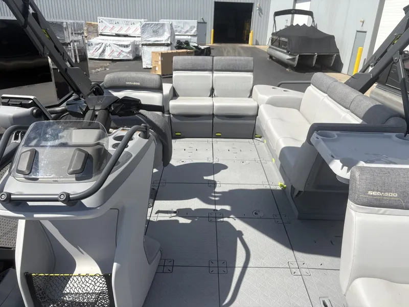 Slide: The Image of The image shows the spacious deck of a 2023 Sea-Doo Switch Cruise 21. - 8