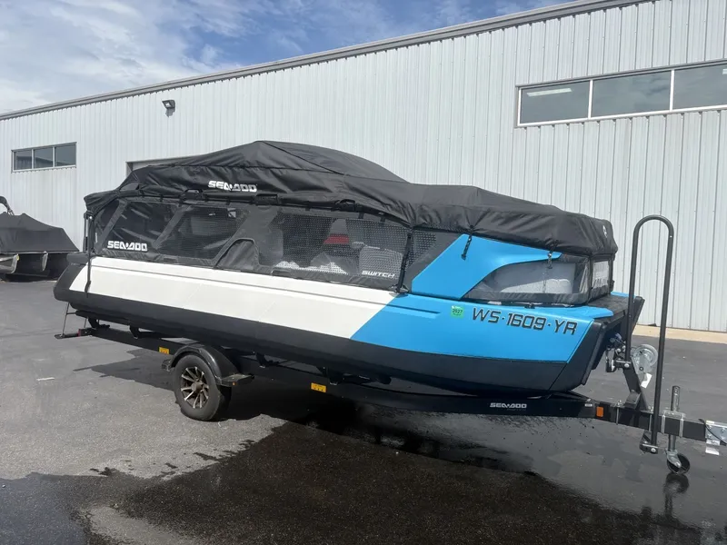 Slide: The Image of A 2023 Sea-Doo Switch Cruise 21 on a trailer in front of a building. - 7