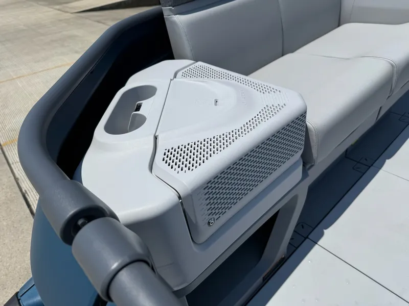 Slide: The Image of The image shows part of the seating area of a Sea-Doo Switch Cruise 21 with gray upholstery. - 5