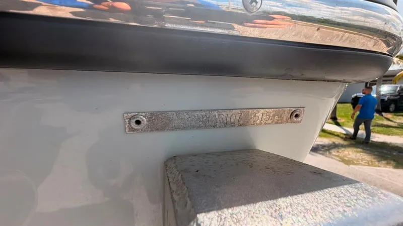 Slide: The Image of Close-up of a boat hull with a metal plaque. - 6