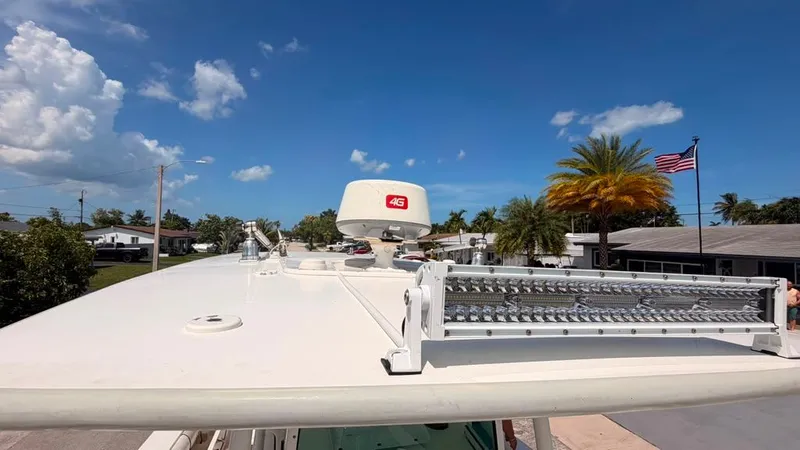 Slide: The Image of The image shows the roof of a Mako 284 Center Console boat with radar and antenna. - 23