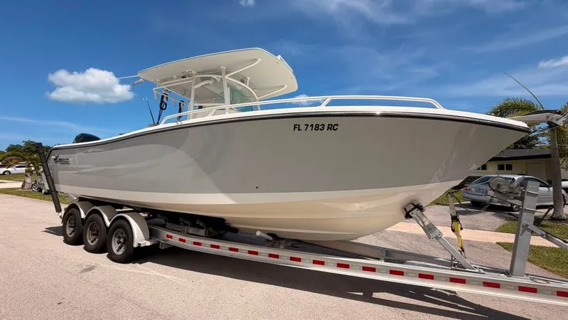 Slide: The Image of 2015 Mako 284 Center Console on a trailer, ready for the water. - 7
