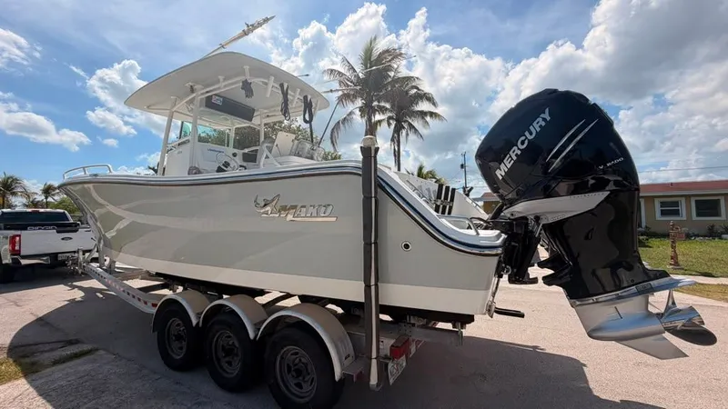 Slide: The Image of A 2015 Mako 284 Center Console boat on a trailer, ready for the water. - 2