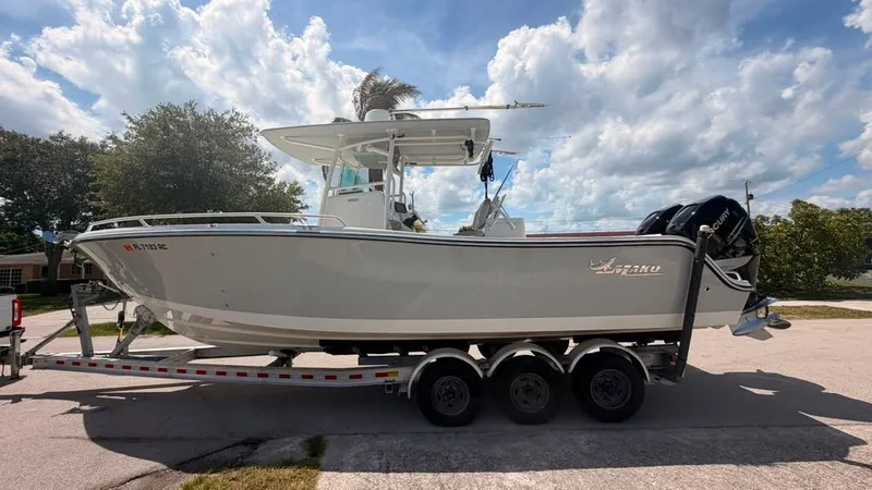 Slide: The Image of A 2015 Mako 284 Center Console boat on a trailer, ready for the water. - 1