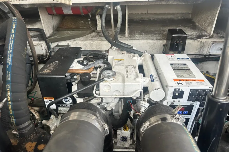 Slide: The Image of Engine compartment of a 2007 Sea Ray Sundancer 310 with Kohler generator. - 47