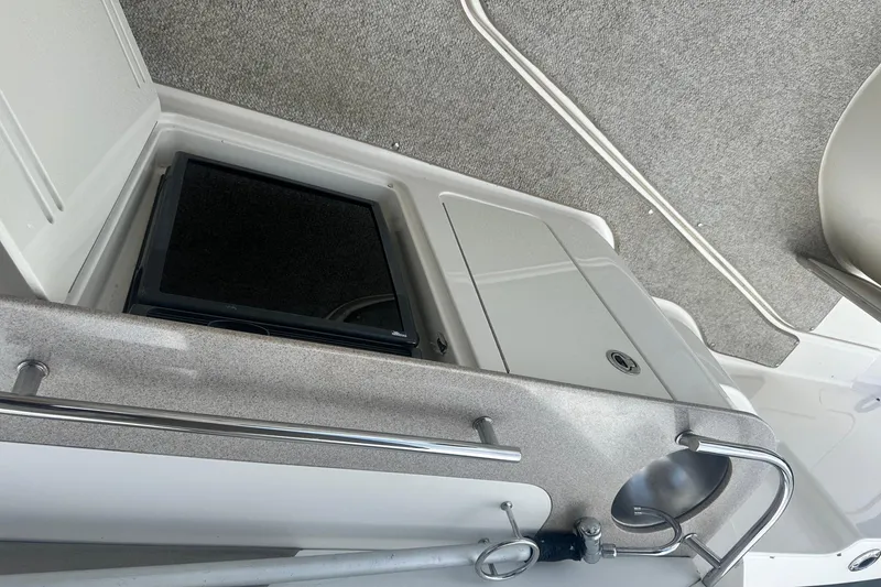 Slide: The Image of 2007 Sea Ray Sundancer 310 interior with sink and storage compartment. - 17