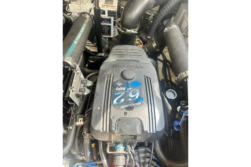 Slide: The Image of Engine of a 2007 Sea Ray Sundancer 310 boat, featuring a MerCruiser 6.2 MPI. - 49